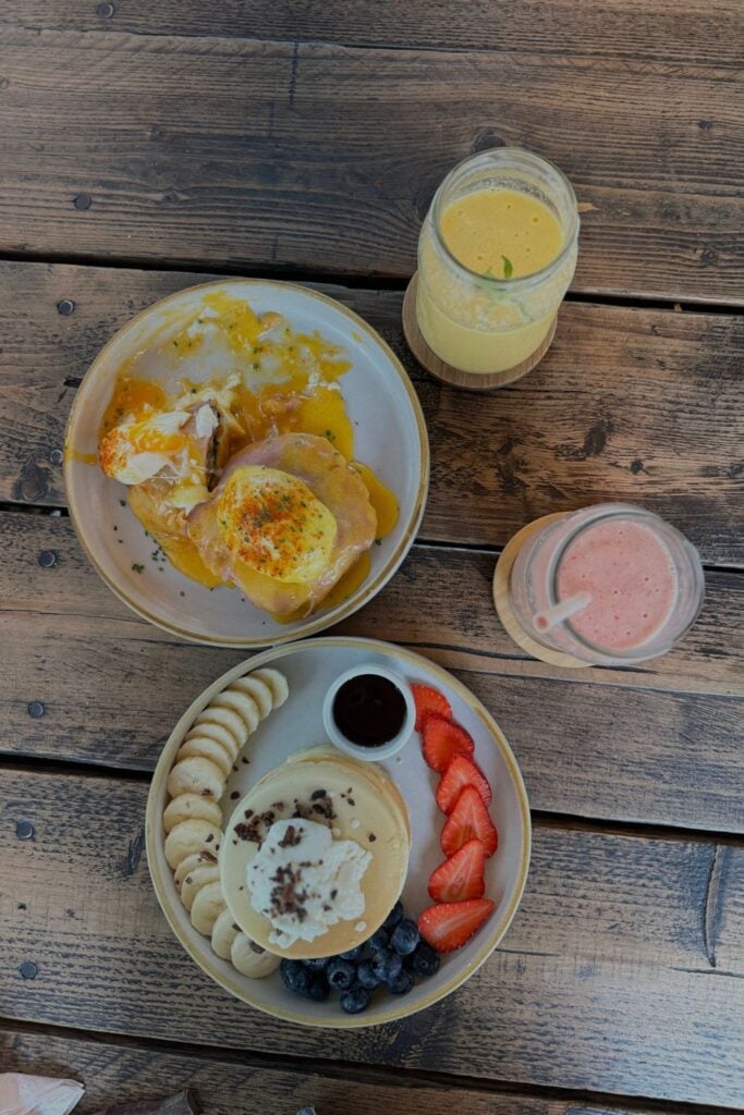 pancakes, eggs and fruit juice in a cafe in Lima