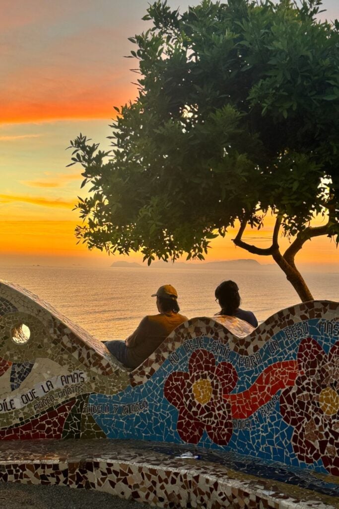 two people watching the sunset at Parque Del Amor 