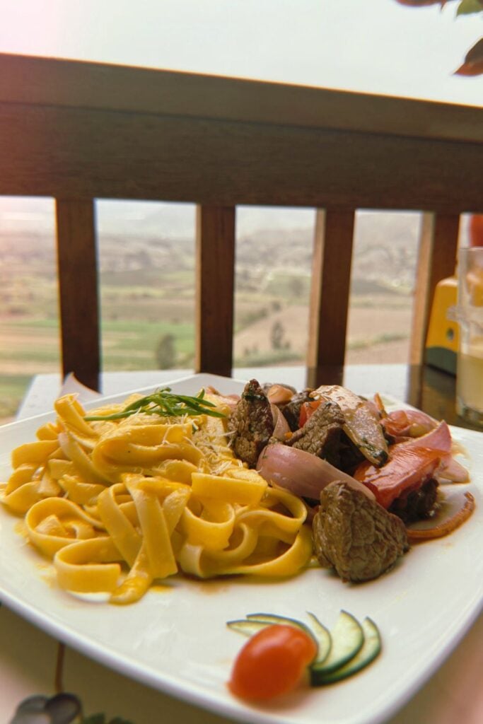 Solo Travel in Peru: A Guide From Someone Who Lives There 24 a plate of lomo saltado in Peru