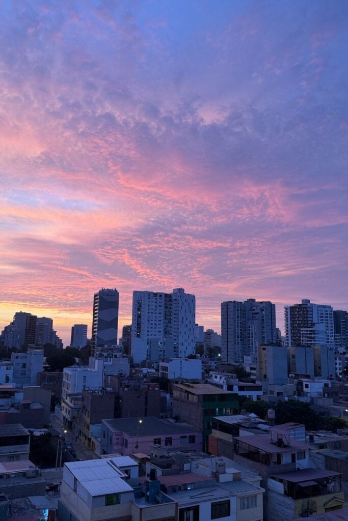One day in Lima at night with building and a sunset