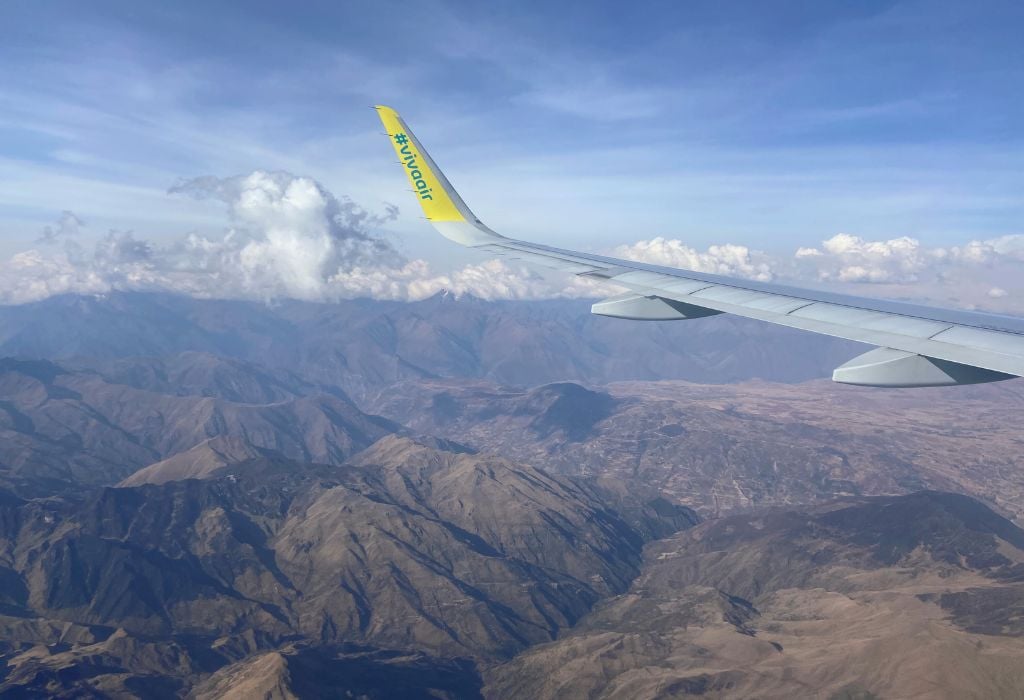 Solo Travel in Peru: A Guide From Someone Who Lives There 18 view from the plane seat over the mountains in Peru