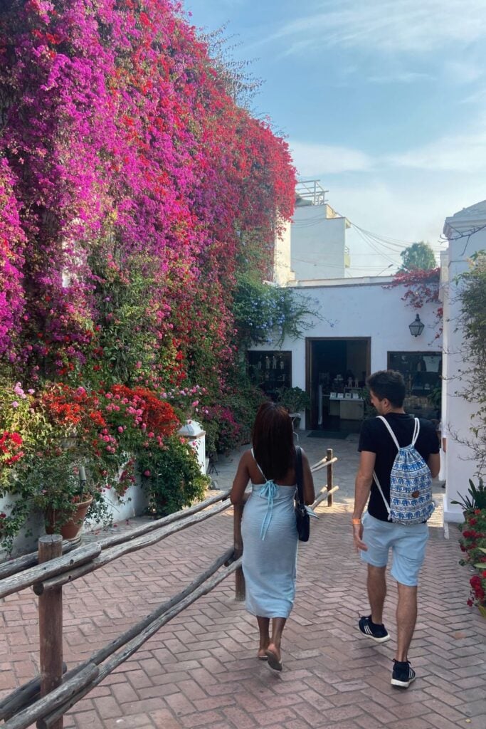 two people walking into the Larco Museum 