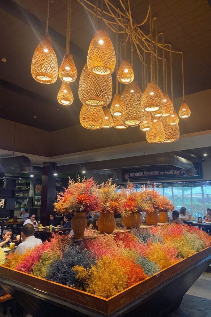 lights and flowers inside a Peruvian restaurant