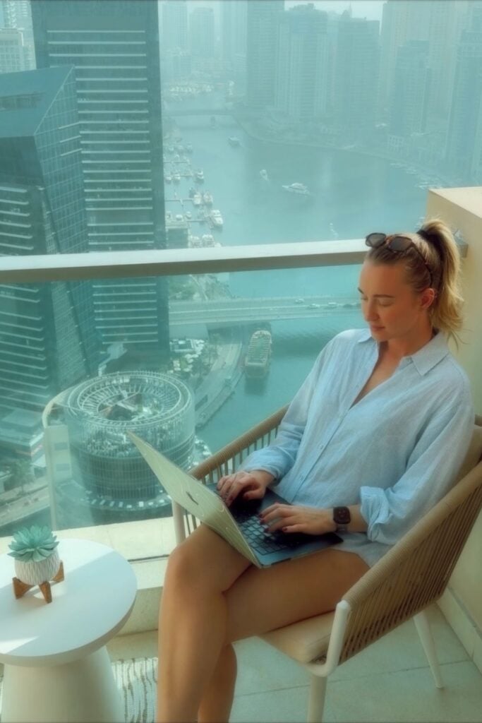 digital nomad on a laptop on the balcony